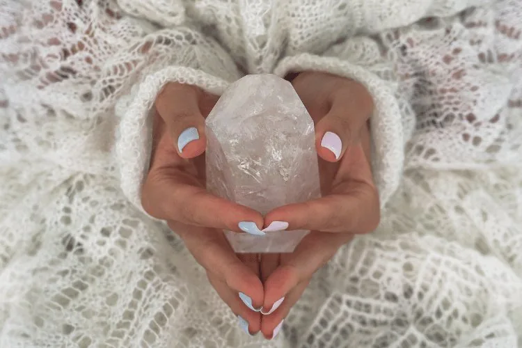 hand holding crystal image