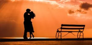 An image depicting a couple kissing