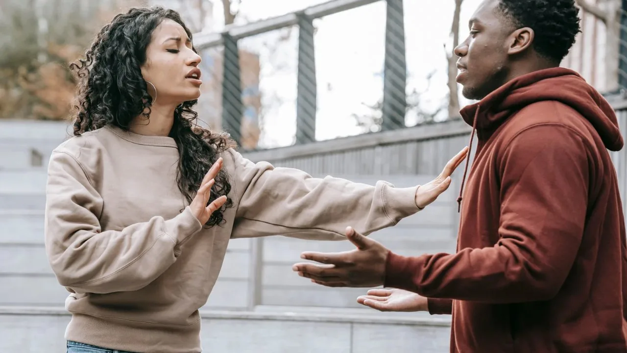 A man and woman arguing