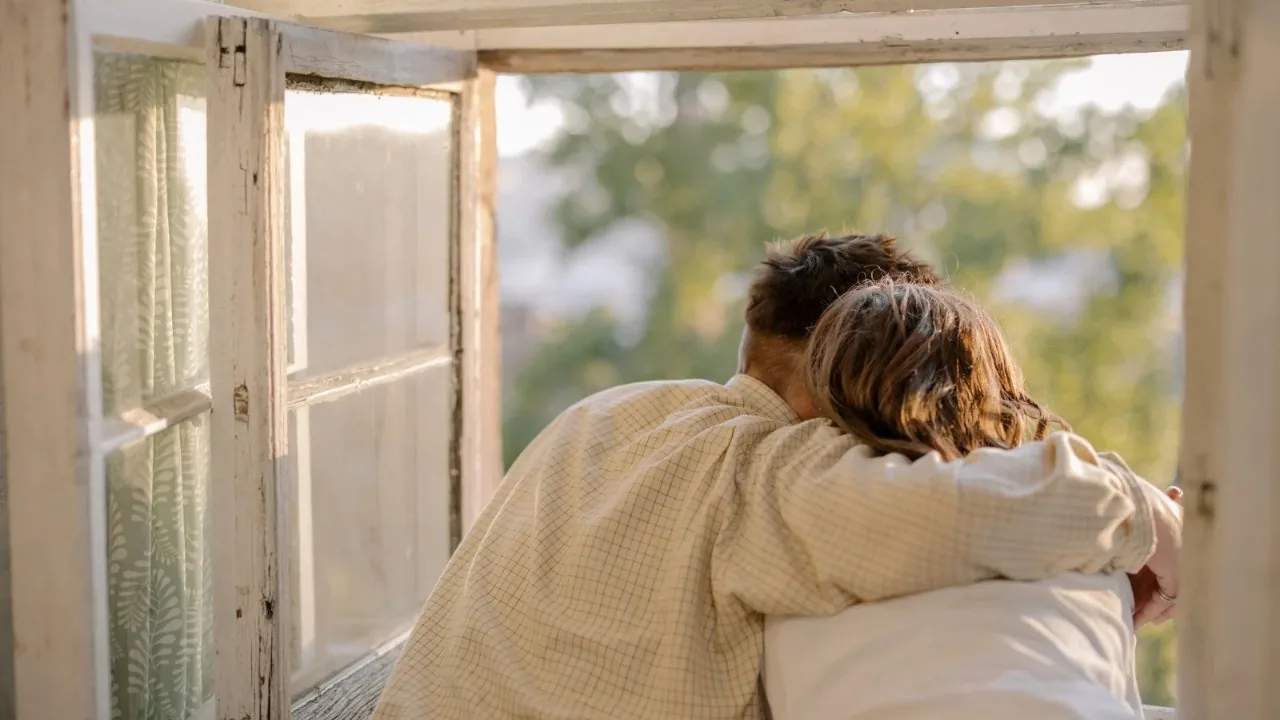 man and woman hugging from the back