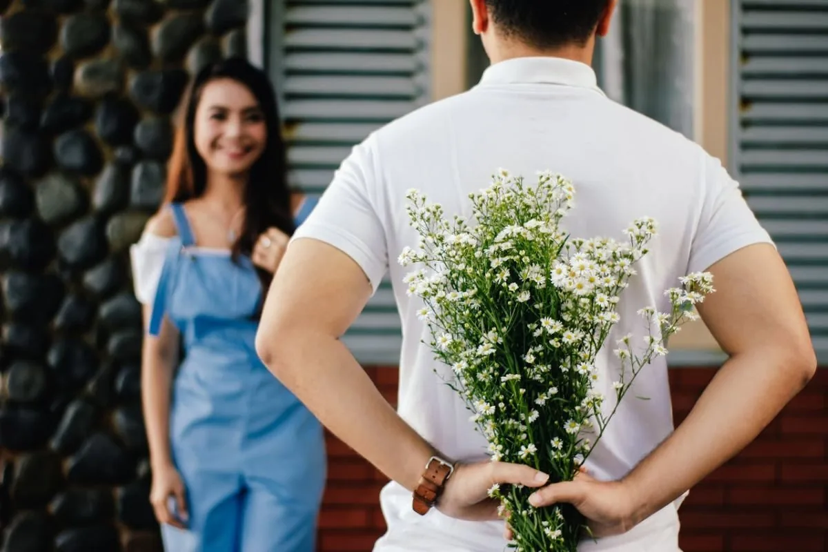 man bringing gift to woman
